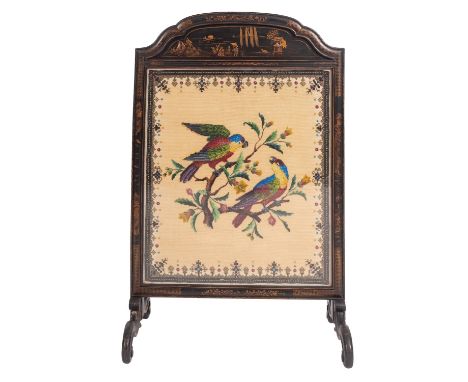 A black lacquered wood and beadwork embroidered firescreen, second quarter 19th century; the arched top and frame all decorat