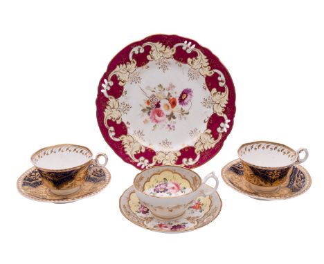 A mixed lot of early 19th century Coalport and Spode wares comprising a Coalport ruby ground dessert plate painted with a cen