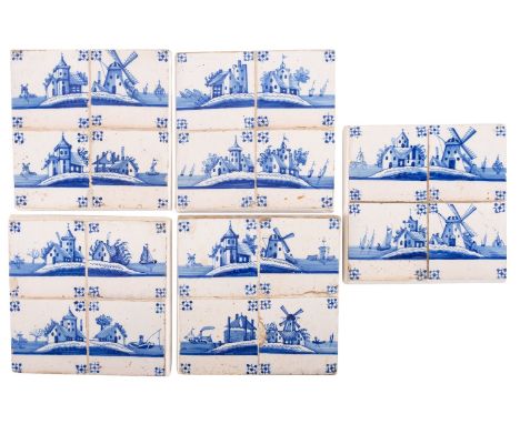 A set of twenty Dutch Delft blue and white tiles in panels of four, painted with windmills and other riverside buildings, eac