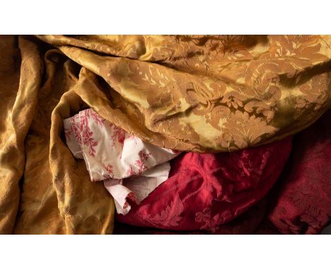 A large quantity of Damask and other fabrics, 20th century; including two pairs of crimson damask curtains, lined and interli