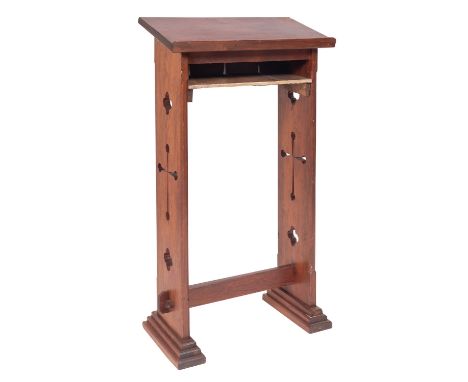 A Victorian pitch pine lectern, late 19th century; with later shelf beneath the Book rest; the pierced sides with quatrefoils