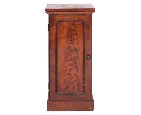 A Victorian mahogany pot cupboard, mid 19th century; the top with moulded lower edges, above a panel door and plinth base; 80