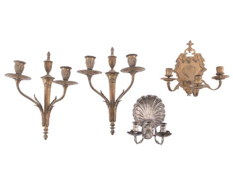 A pair of gilt metal twin light wall appliques in Empire style, early 20th century; each with laurel cast urn sockets and ree