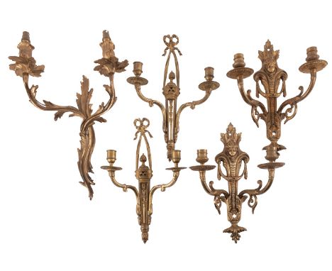 A pair of gilt metal twin light wall appliques in Louis XV / XVI Transitional style, 20th century, each with foliate cast soc