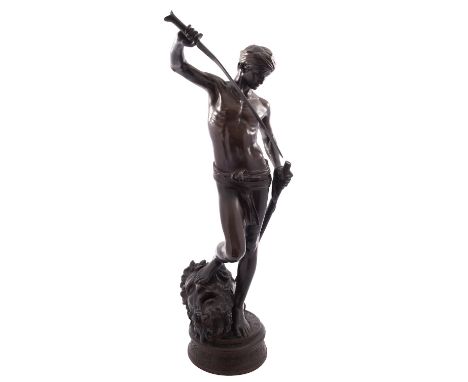 After Jean-Antonin Mercie, (French 1845-1916), a patinated bronze model of David with the head of Goliath, late 19th century;