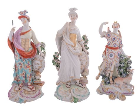 A group of three Derby figures comprising two depicting Minerva, the goddess of Wisdom, each with a shield, an owl and stack 