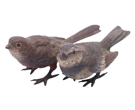 A small Austrian cold painted bronze group of two birds, early 20th century; naturalistically cast and painted, stamped Gesch