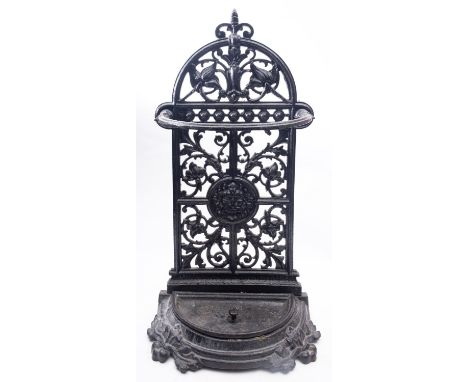 A Victorian painted cast iron stick stand, late 19th century; with openwork scrolling foliate cast arched back and demi-lune 