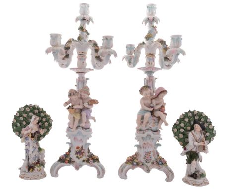 A pair of Sitzendorf porcelain five-light figural candelabra and a pair of Frankenthal-style bocage figures of a shepherd and