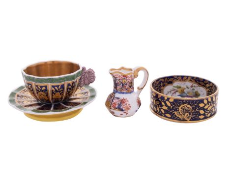 Three pieces of early 19th century Spode porcelain comprising a miniature octagonal jug in the Imari palette, script mark wit