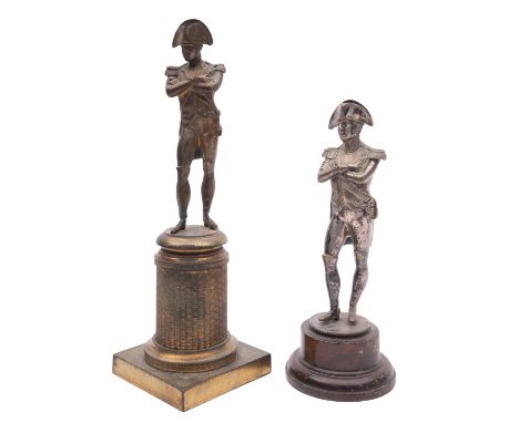 Two bronze models of Napoleon Bonapart, mid 19th century; identically posed standing with arms folded; the gilt example with 