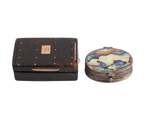 A tortoiseshell and yellow metal mounted snuff box, early 19th century; the top with pressed geometric motifs around an inset