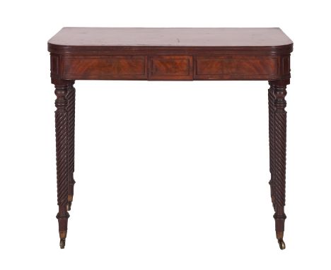 A Regency mahogany tea table, circa 1815; the hinged rectangular top with rounded front corners and reeded edges; above panel