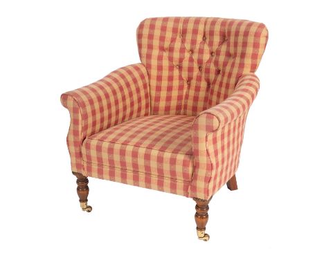 A button upholstered armchair, 20th century; with Zoffany checked fabric overall; with turned wood front legs with brass caps