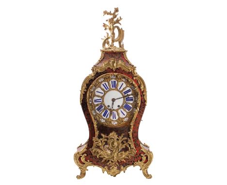 A French Victorian red tortoiseshell and brass boulle bracket with bracket the eight-day duration movement striking the hours