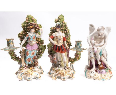 A pair of French candlestick figures in the Derby manner of Mars and Minerva together with a Derby figure of Father Time, the