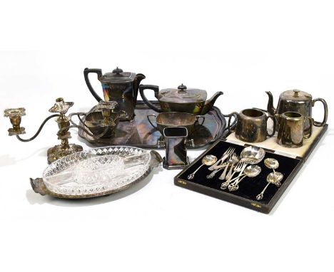 A mixed group of electroplated items to include a tea set, spoons and a candlestick.