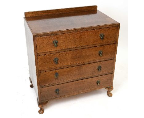 A 1950s oak chest of four drawers, on bun feet, width 76cm, depth 46c, height 84cm.Condition Report: Some staining and marks 
