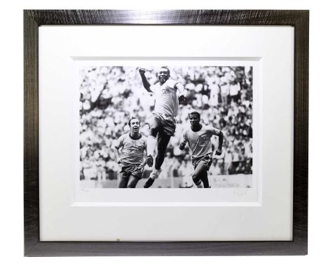 PELE; a pencil signed limited edition black and white print of Pele celebrating, numbered 45/225, with certificate of authent
