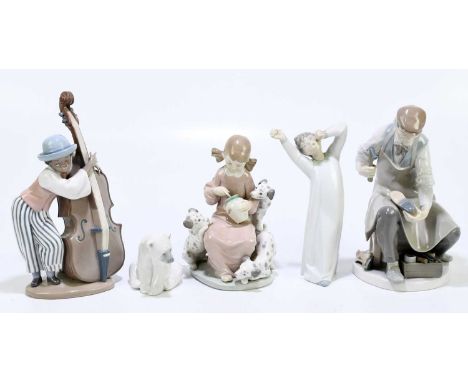 LLADRO; three figure group comprising 'Cobbler', 'Boy with Double Bass' and 'Girl with Puppies', height of tallest 25cm, with