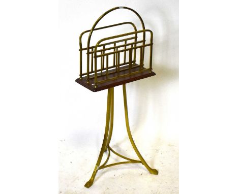 A late 19th century brass oak revolving magazine/book stand, height 84cm.