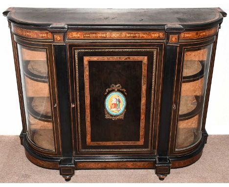 A 19th century burr walnut and ebonised credenza with gilt metal applied beading, the central door with hand painted porcelai