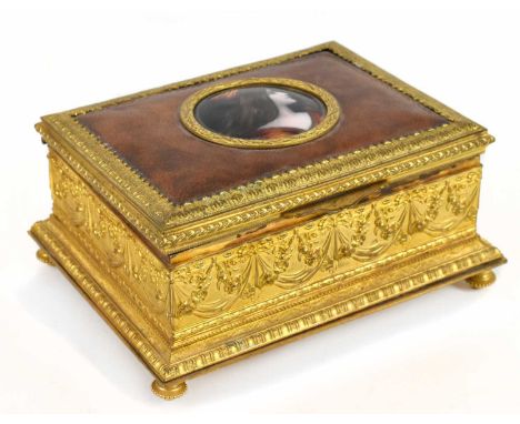 LIMOGES; a gilt metal leather set rectangular trinket box, the hinged lid centred with the circular enamelled plaque painted 