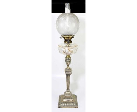 A late 19th century/early 20th century silver plated oil lamp with bulbous etched glass shade, cut glass reservoir and silver