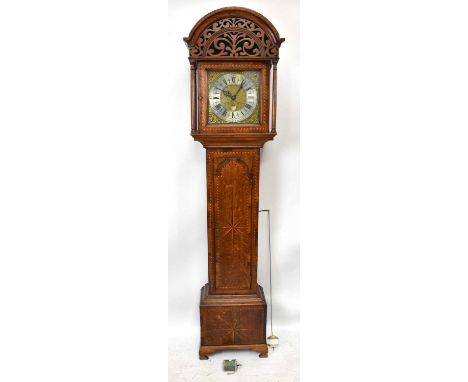 JONATHAN LEES, BURY; an 18th century oak cased longcase clock, the hood of arch form with carved detail above the inlaid hood