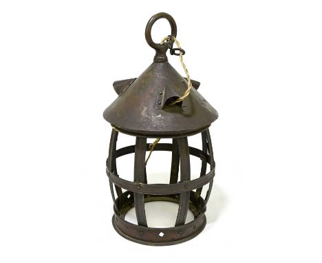 An Arts and Crafts copper lantern of barrel form, with studded detail, height 31cm, lacking glass.
