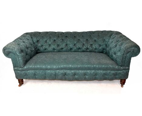 A Victorian two seater Chesterfield sofa upholstered in a button back floral material.Condition Report: The sofa is height72c