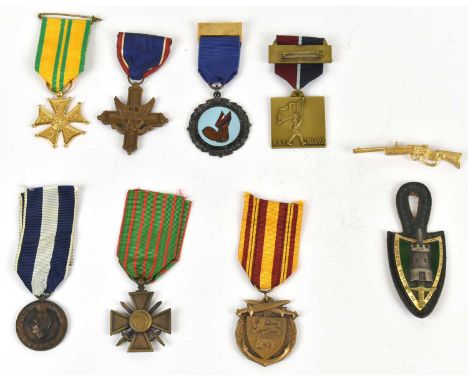 A group of seven foreign medals including a 1940 Dunkirk medal, with a post WWII Allied Forces leather and a gilt and enamel 