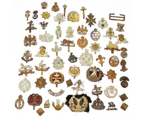 A collection of approximately fifty assorted military cap badges including the Westminster Regiment, Royal Indian Army Servic
