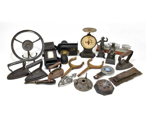 A mixed collection of metalware to include miniature irons, figures and a door lock, etc.