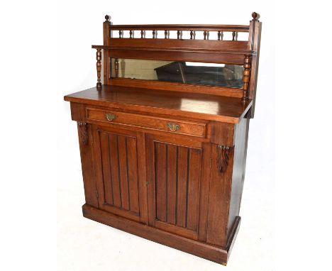 An Edwardian walnut chiffonier with raised mirror back above a single drawer and two panelled doors, on plinth base, height 1