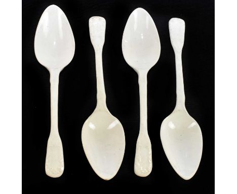 Four late 18th century English ceramic 'Fiddle' pattern dessert spoons, with moulded scroll detailing to the fiddles, unmarke