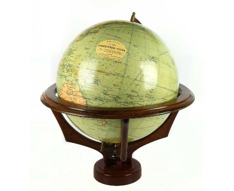 PHILLIPS; a 19” terrestrial globe on a wooden stand, height approx 64cm.