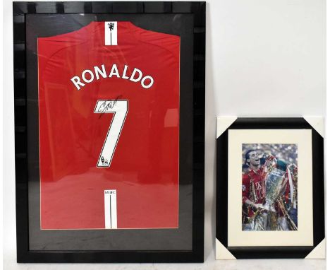 CRISTIANO RONALDO; a framed autographed replica Manchester United jersey, together with a signed photograph of Cristiano lift