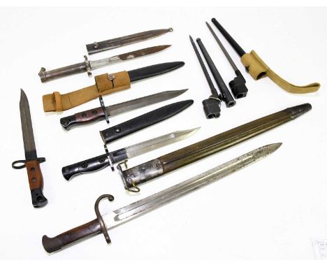 A collection of seven bayonets, to include a Remington with associated scabbard, two Enfield type spike bayonets, two carbine