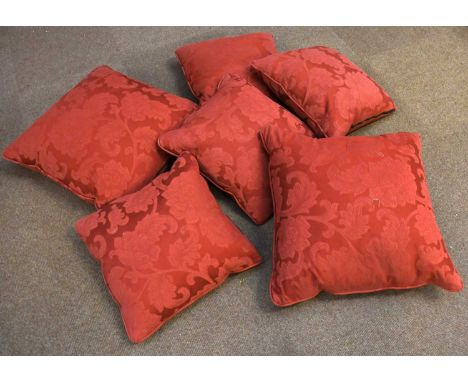 Six modern red floral cushions, the largest approx 55 x 55cm.Condition Report: General light wear through use but essentially