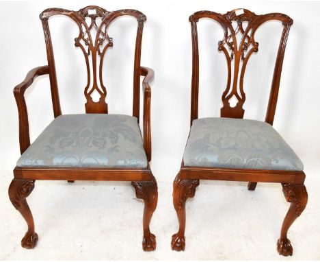 A set of eight reproduction carved mahogany Chippendale style dining chairs including two with arms, with carved and pierced 