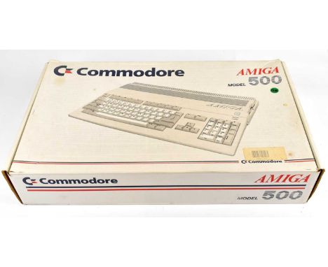 COMMODORE 500; a boxed computer console with two controllers and six arcade games.