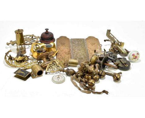 A mixed quantity of brassware to include a miniature miner's lamp, door knobs, etc.