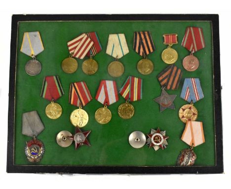 A collection of Russian medals and orders to include a white metal and red enamel Red Army medal, numbered 187801, two CCCP m