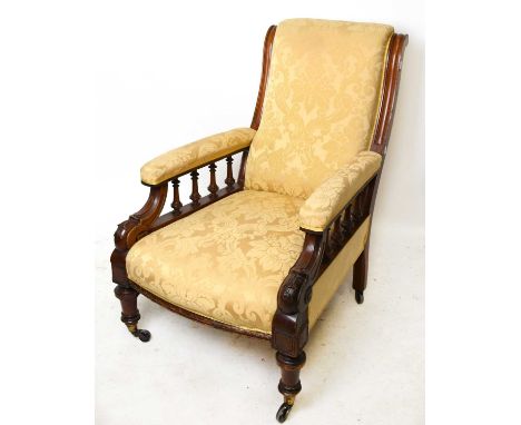 A late Victorian carved walnut framed armchair upholstered in a modern floral material.Condition Report: Frame with age wear 
