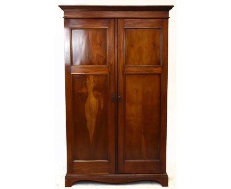 A late Victorian mahogany two door wardrobe, with moulded cornice on base with bracket feet, height 216cm.Condition Report: T