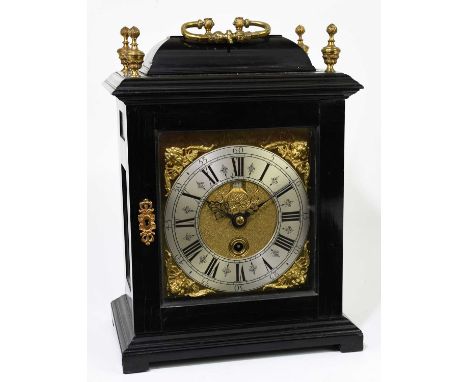 JASPER TAYLOR, GRAYS INN; a 17th century ebonised bracket clock with cast brass loop handle and four finials to the rectangul