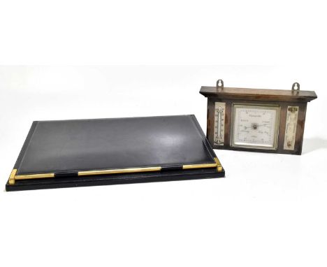 An early 20th century oak hanging barometer / thermometer, 19 x 33cm, together with a Rustion Italian leather desk blotter (2