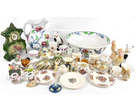 A large collection of sundry ceramics to include a wash bowl and jug, a ceramic clock, Royal commemorative ware, etc.
