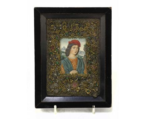A 17th century portrait miniature, oil on panel representing a male figure wearing a red cap with curly hair, inside a jewell